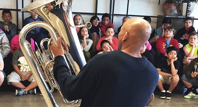 A tuba teacher and students